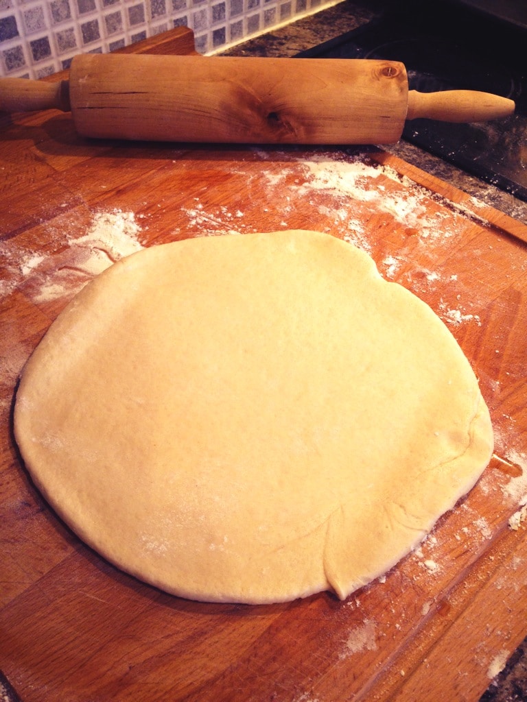 rolling out the pizza dough