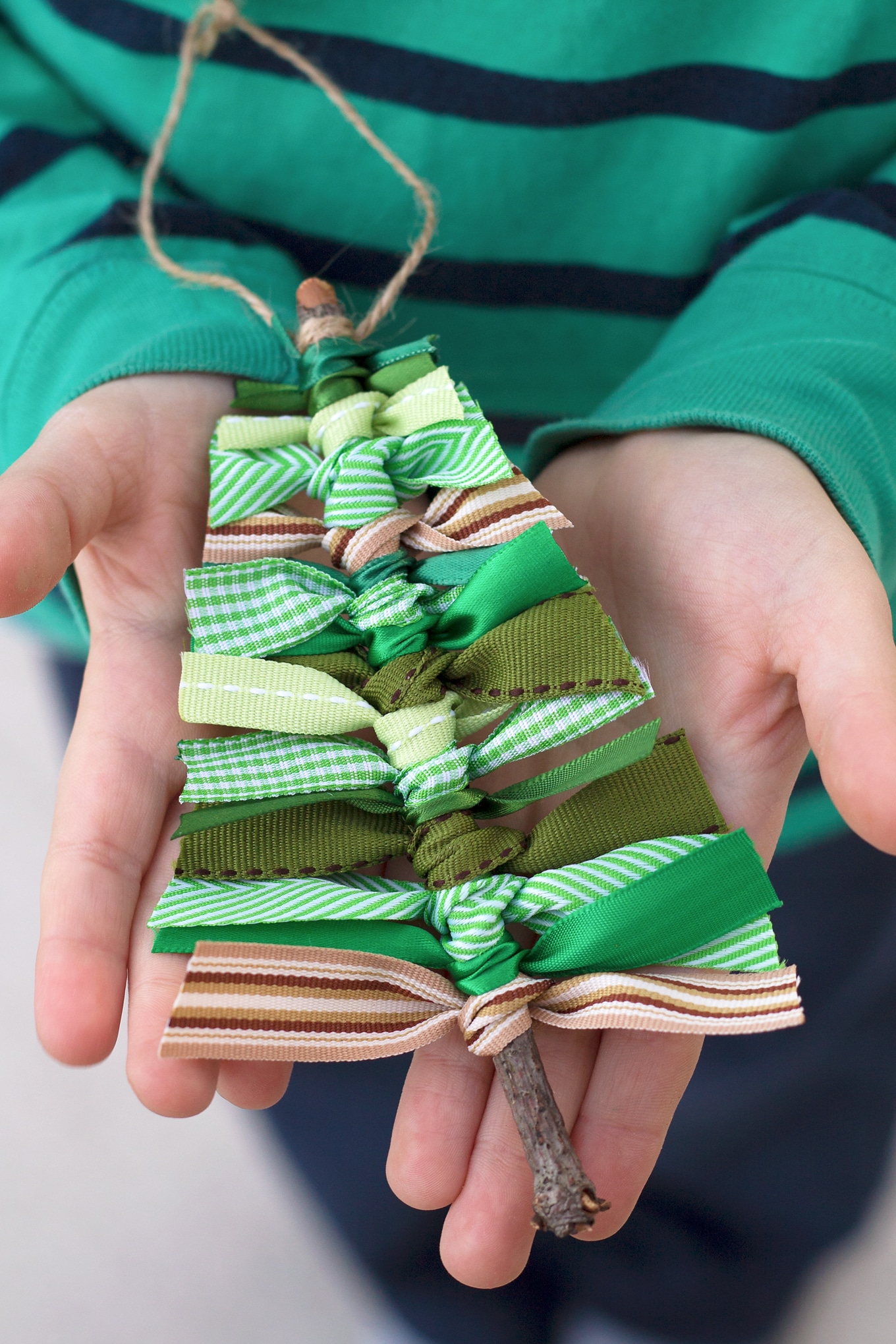 Go out to the park and burn off some energy. While you're there collect some twigs, then tie up some scrap ribbon, to make some cute Christmas tree decorations.