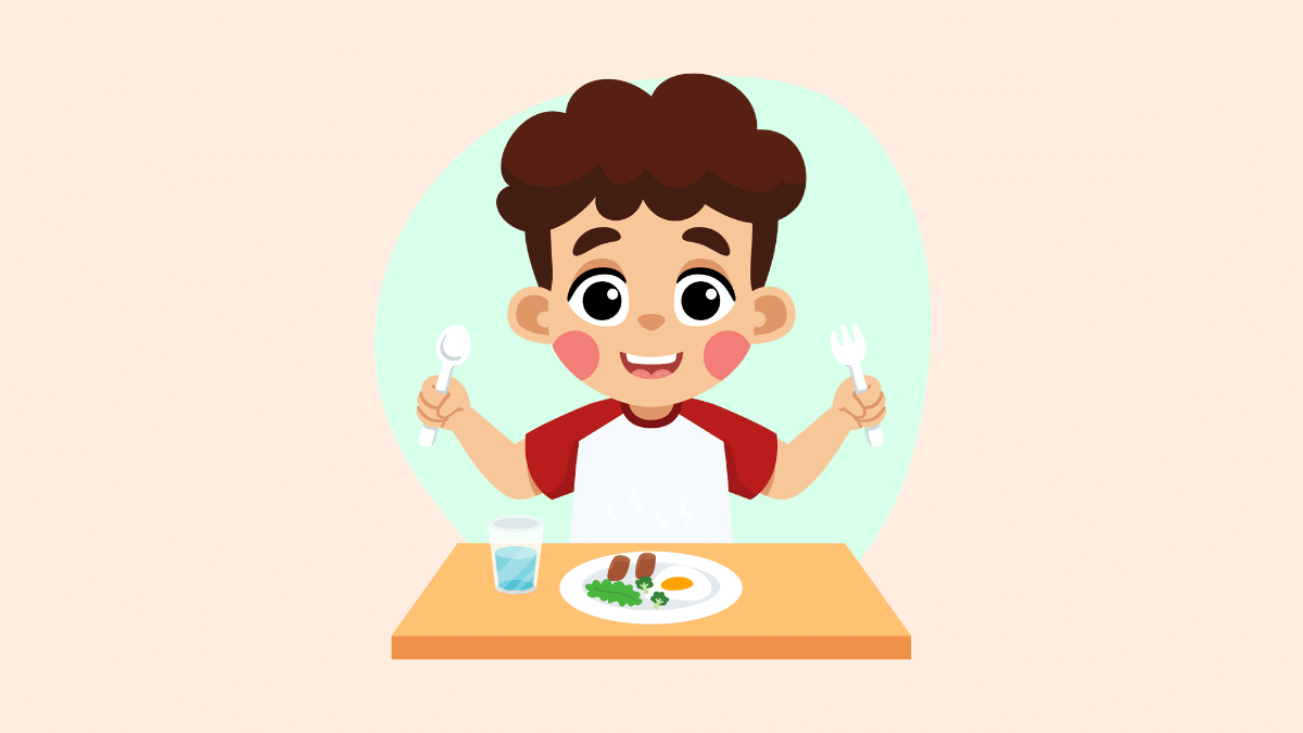 Cartoon of a boy sitting at a table with a plate of food and a glass of water.  He holds a knife and fork in the air and smiles.