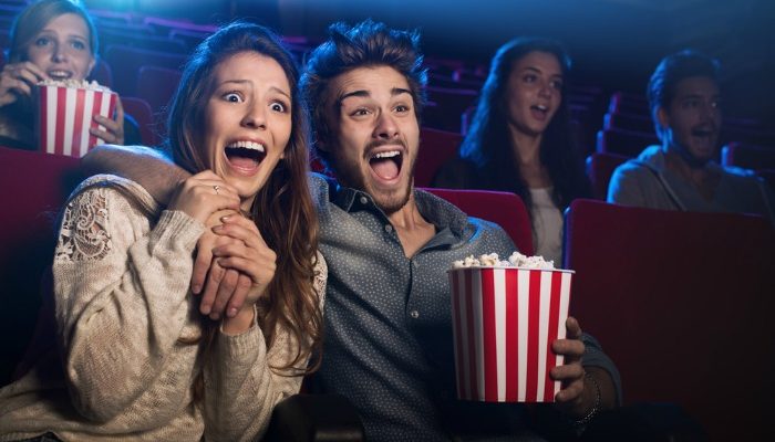 eating popcorn at cinema