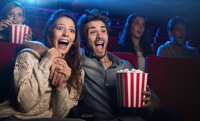 eating popcorn at cinema