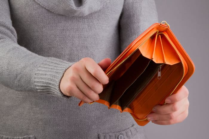 empty purse in women's hands