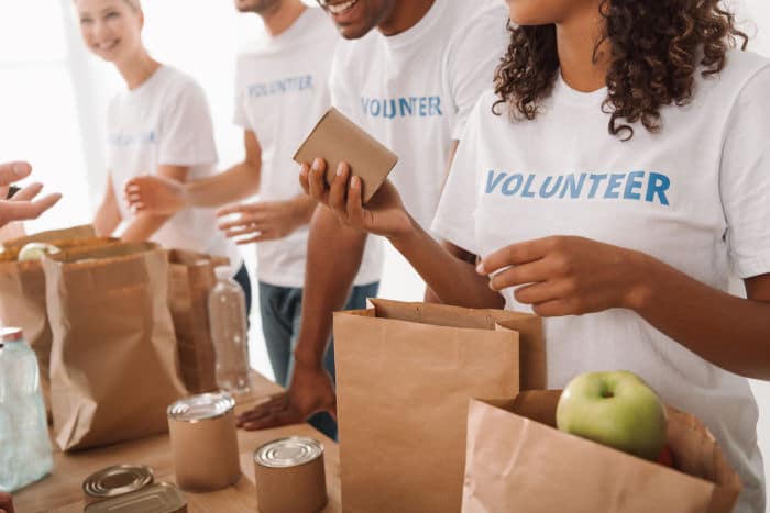 volunteers packing food donations