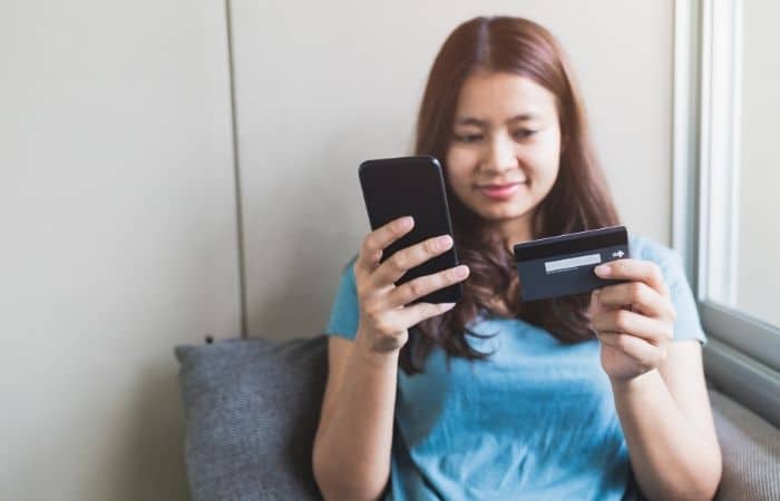 woman paying on phone