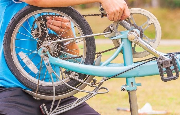 man fixing a bike