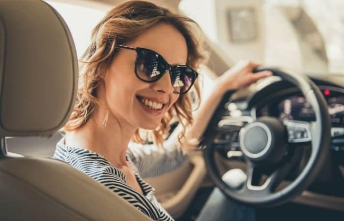 woman smiling in car