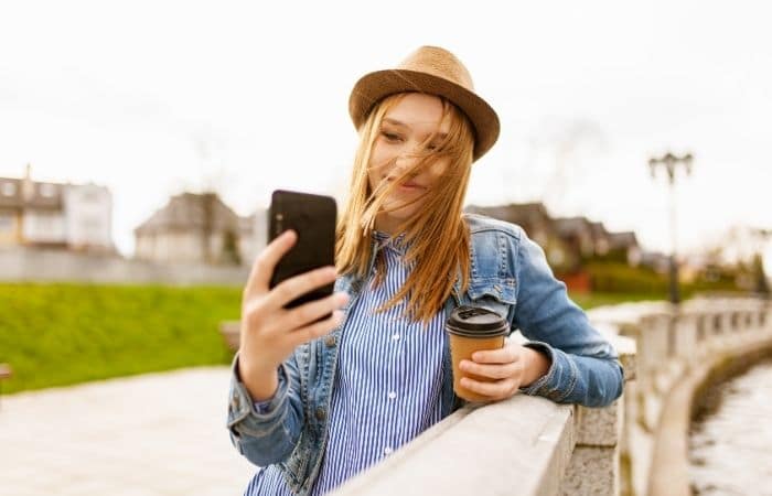 happy woman holding mobile