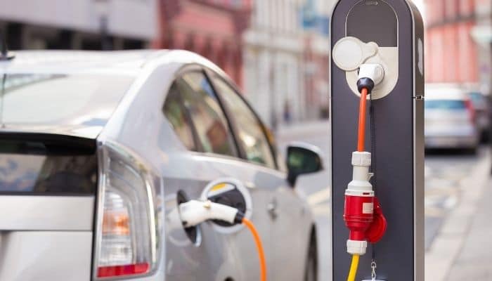 charging an electric car on the road