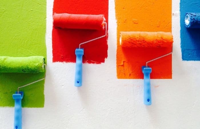 colourful paints on white wall