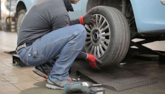 mechanic changing a tyre