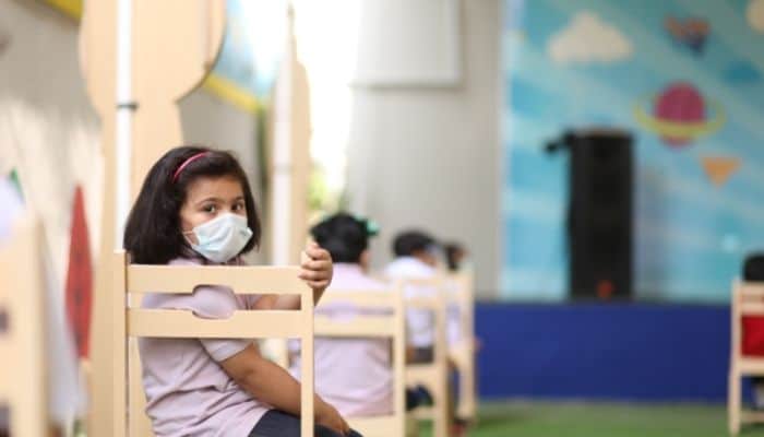 child wearing mask in school