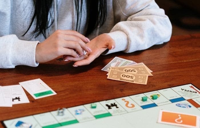 girl playing monopoly