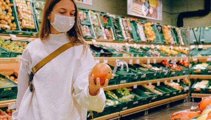 woman wearing a face mask in supermarket