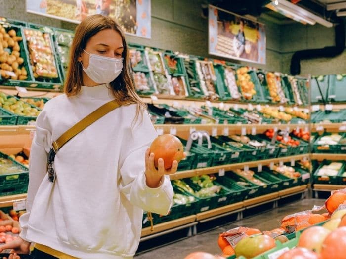 woman wearing a face mask in supermarket