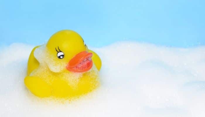 yellow rubber duck in bubbles
