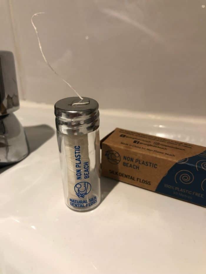 natural silk dental floss on bathroom sink