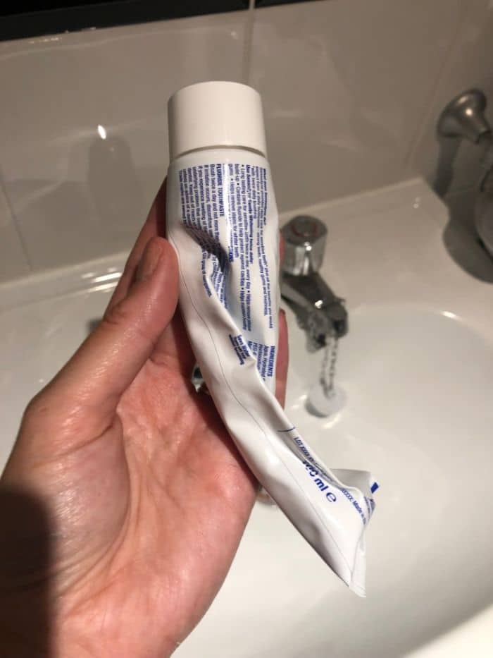 squeezed toothpaste tube