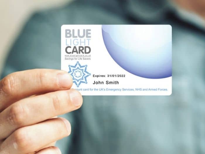 man holding blue light card