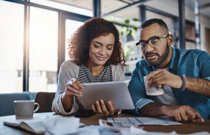 couple looking at tablet