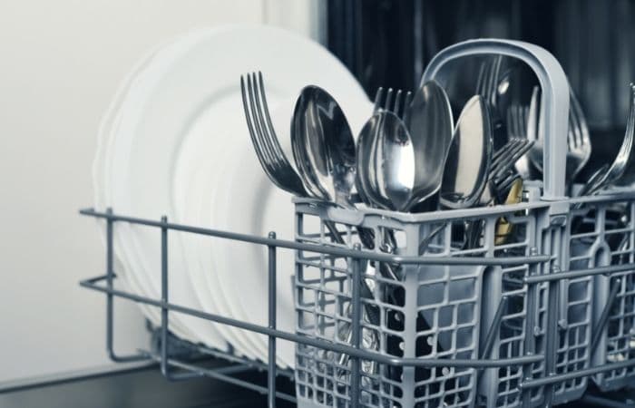 filled cutlery drawer of dishwasher