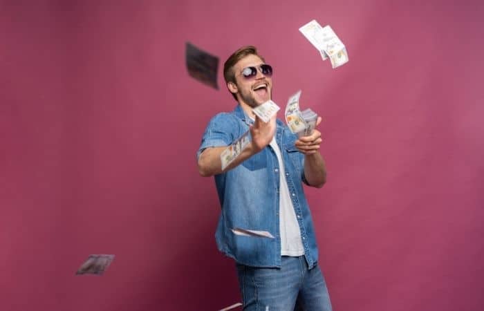 man throwing money