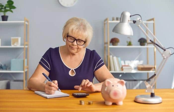 older woman with calculator