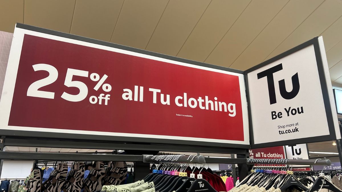 25% off all Tu clothing poster above clothes in a Sainsbury's store