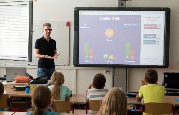 teacher standing at front of class