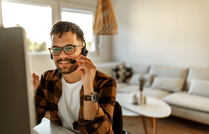 man working from home talking on headset