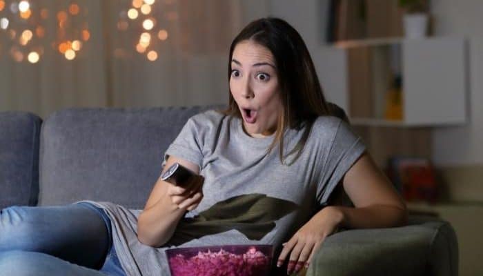 surprised woman watching tv