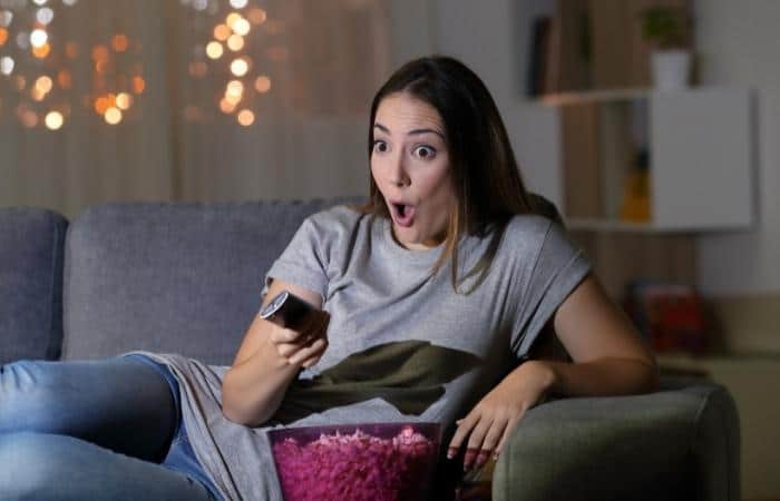 surprised woman watching tv