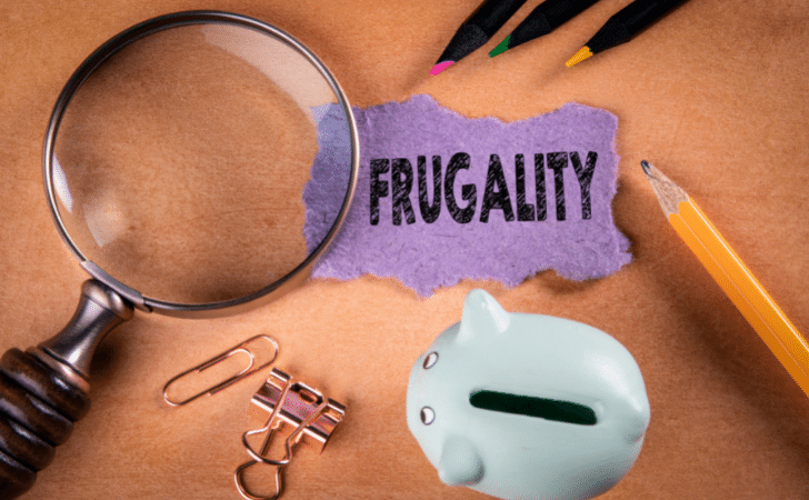 frugality written on a purple piece of paper