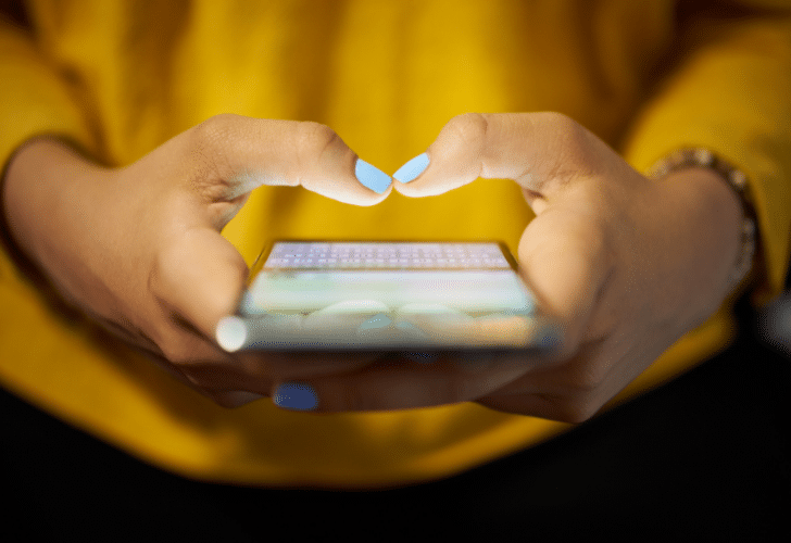 woman looking at phone screen