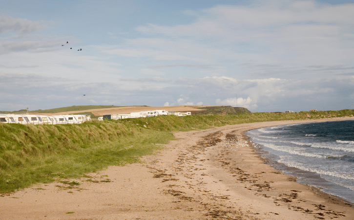 beach by static caravans holiday park