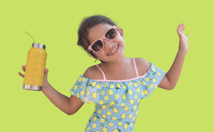 smiling girl with sunglasses on a green background