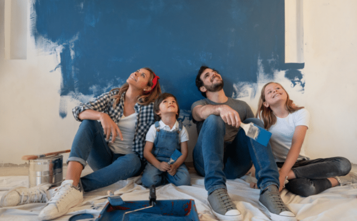 family decorating a council house