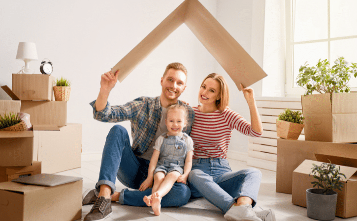 family surrounded by moving boxes