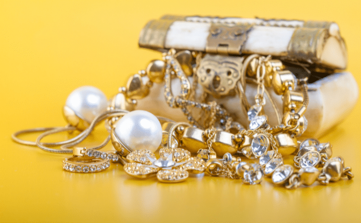gold jewellery on a yellow background