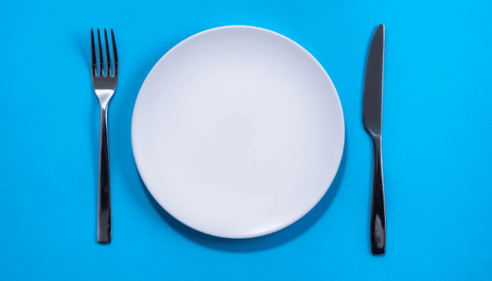 empty plate on blue background