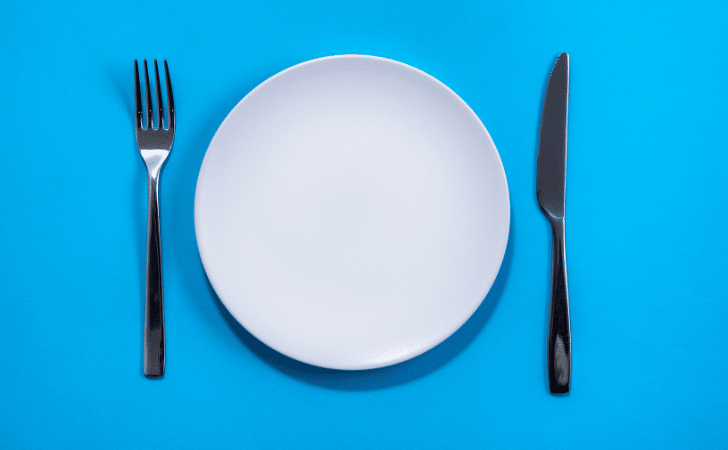 empty plate on blue background