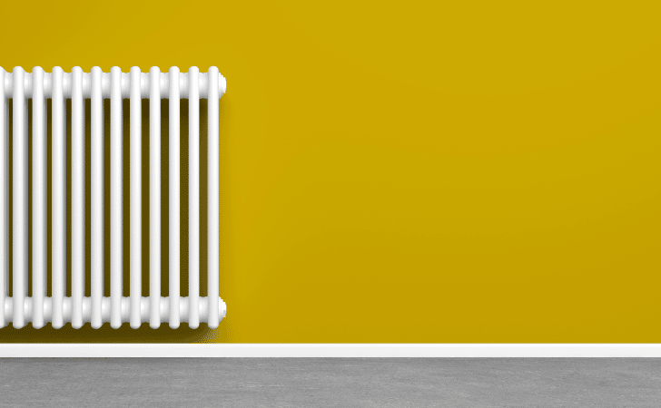 radiator on a yellow wall