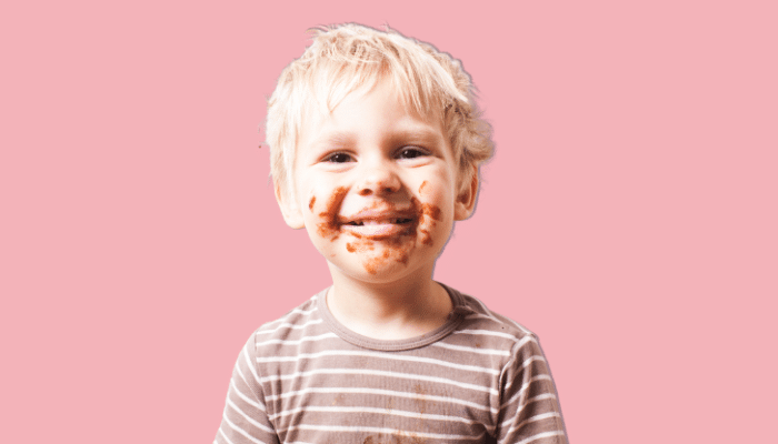 young boy with chocolate around his face