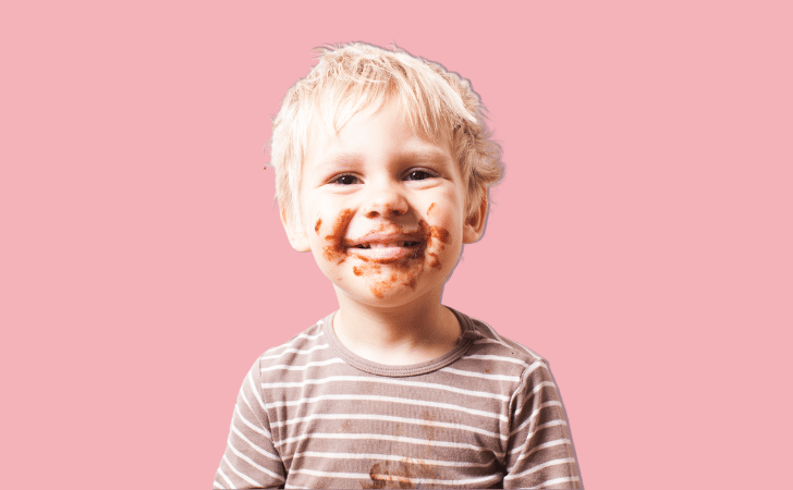 young boy with chocolate around his face