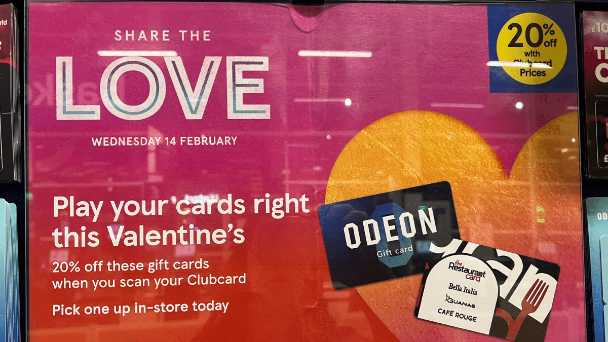 Display poster in a Tesco store showing 20% off Odeon and The Restaurant Card gift cards