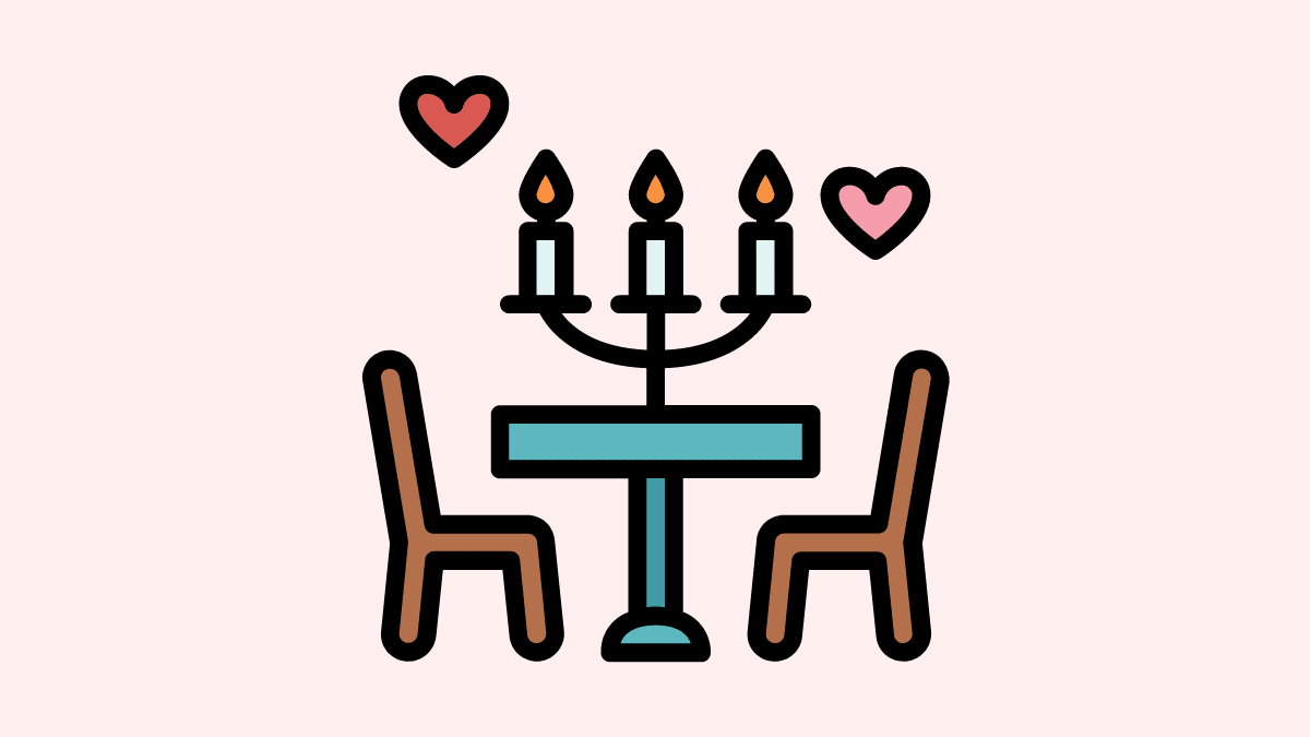cartoon of of a table and two chairs, with lit candles and hearts floating above.