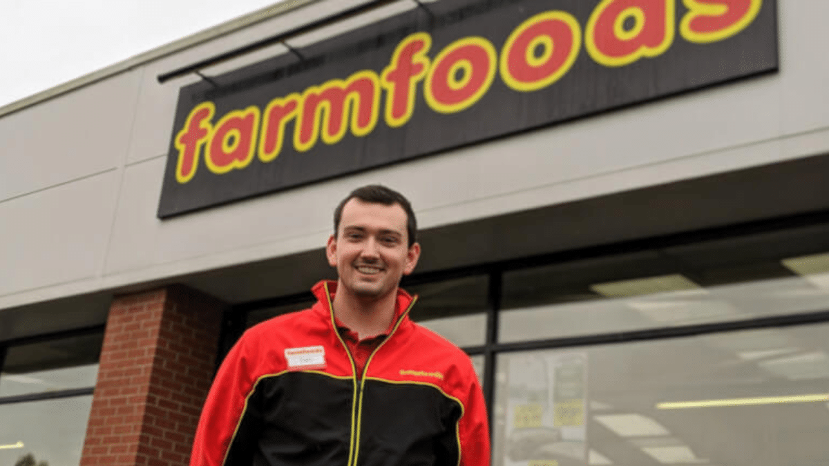 man in a Farmfoods uniform starting outside the supermarket