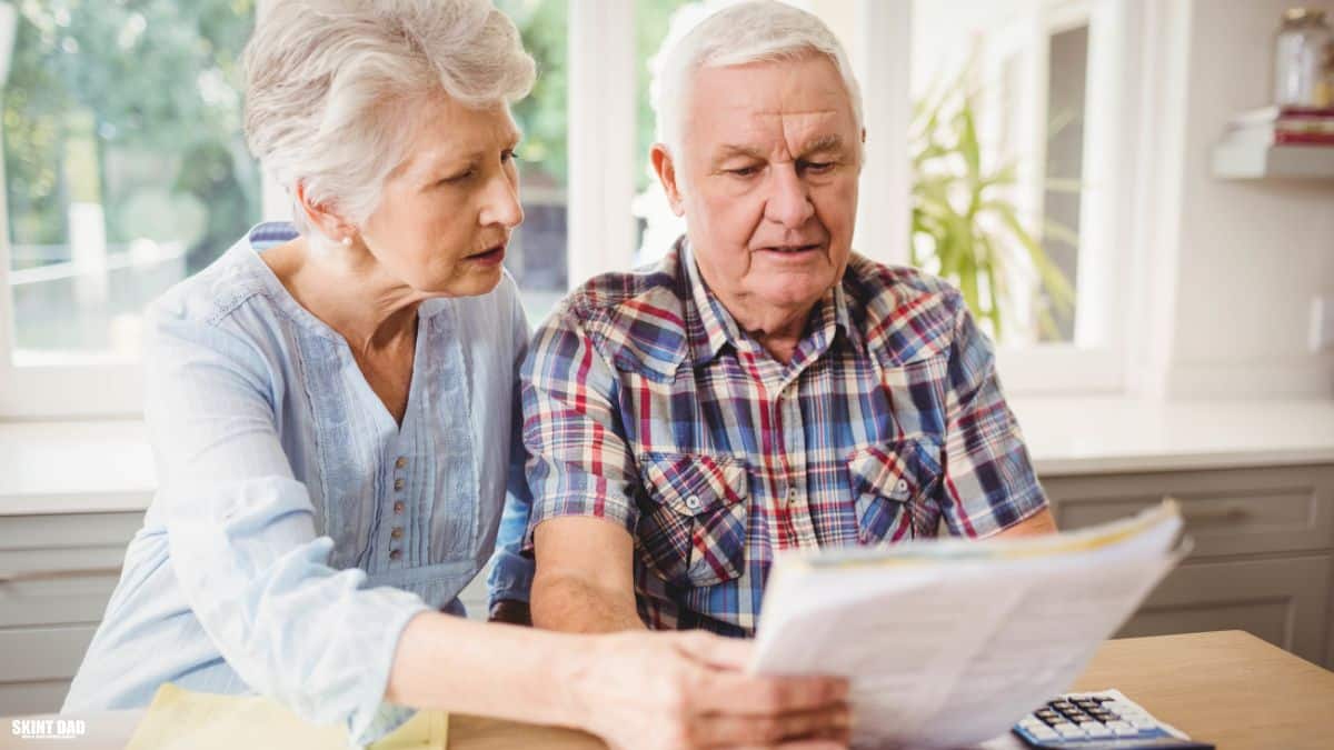 Pensioners looking at paperwork