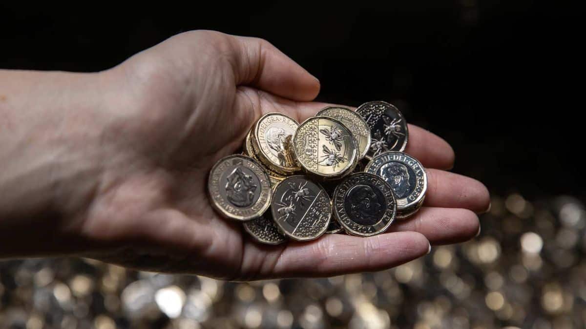 A handful of new Kind Charles III one pound coins