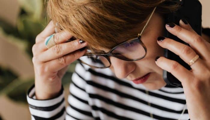 Women on phone looking anxious