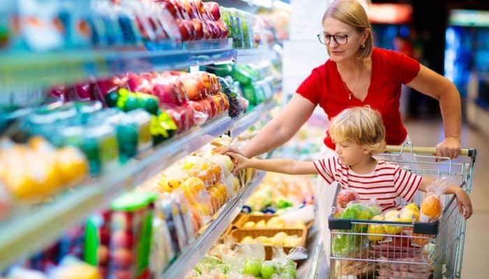 Family buying fruit at a supermarket